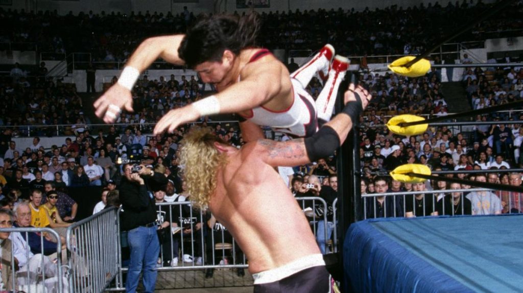 Eddie Guerrero executes a plancha on Diamond Dallas Page.