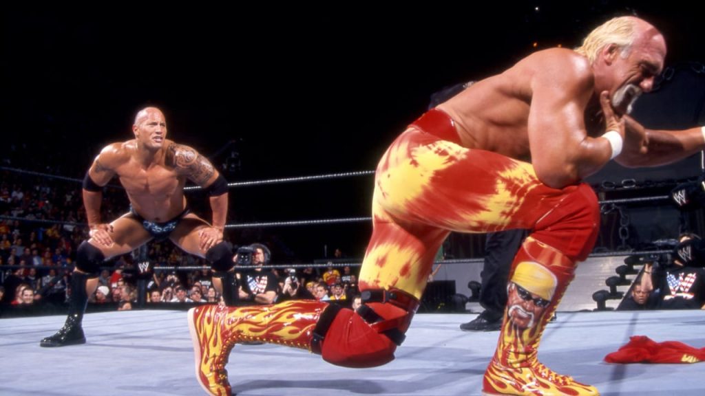 The Rock stalks Hulk Hogan, hoping to hit him with the Rock Bottom.