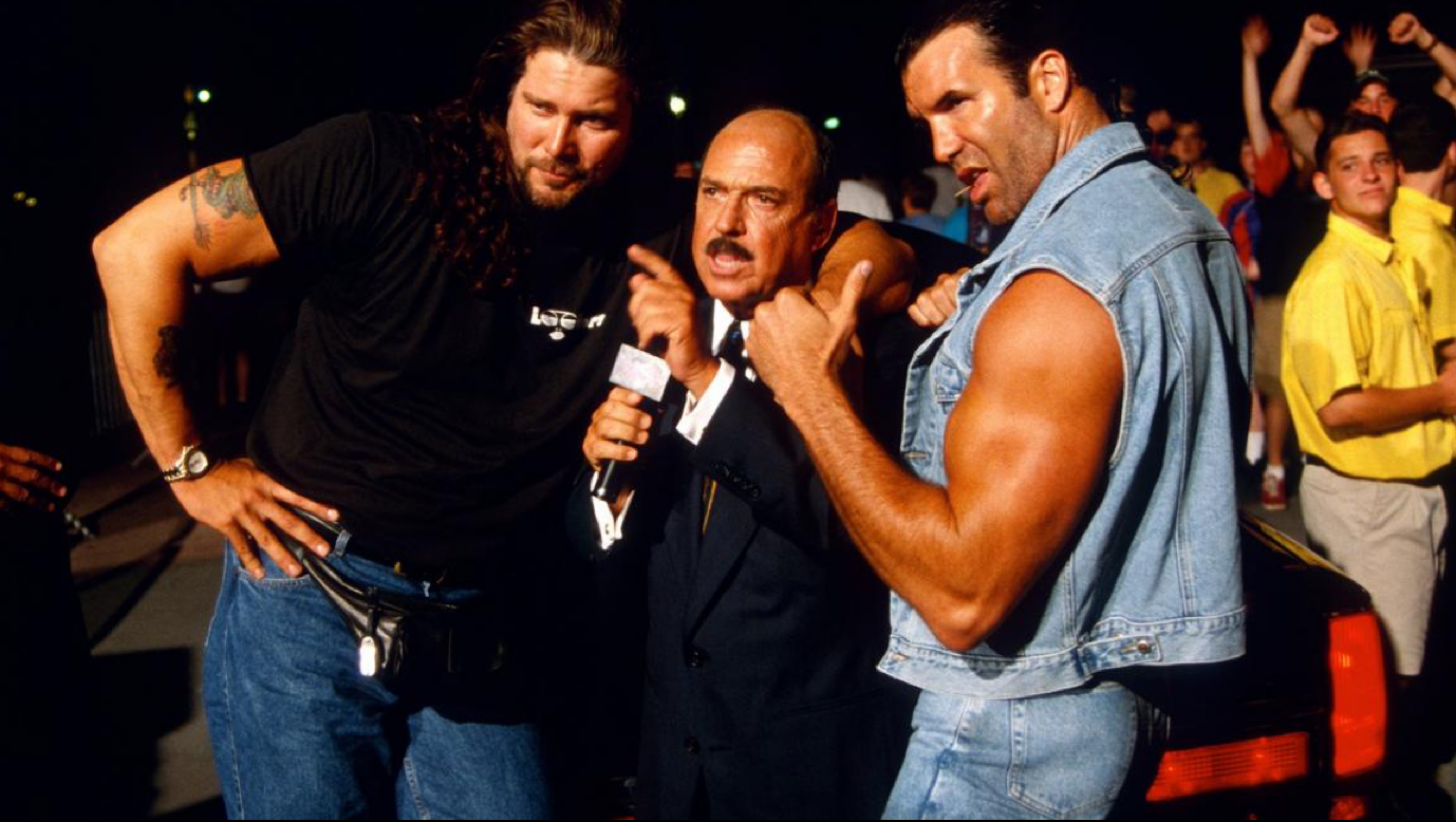 Kevin Nash and a denim tuxedo-clad Scott Hall menace Mean Gene Okerlund