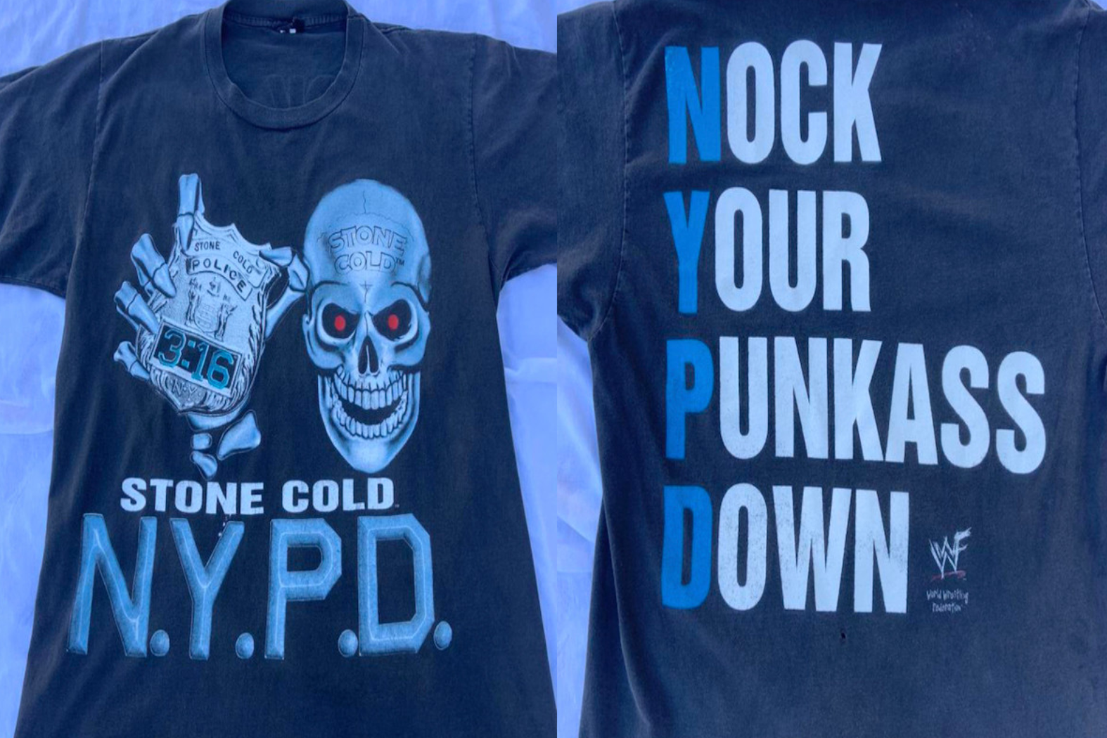 A Steve Austin shirt. The front depicts a skeleton holding an NYPD badge that reads 3:16. It says "Stone Cold NYPD." On the back it reads "NOCK YOUR PUNKASS DOWN"
