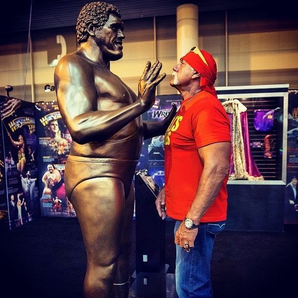 Hulk Hogan ponders his mortality while gazing up at a statue of Andre the Giant.