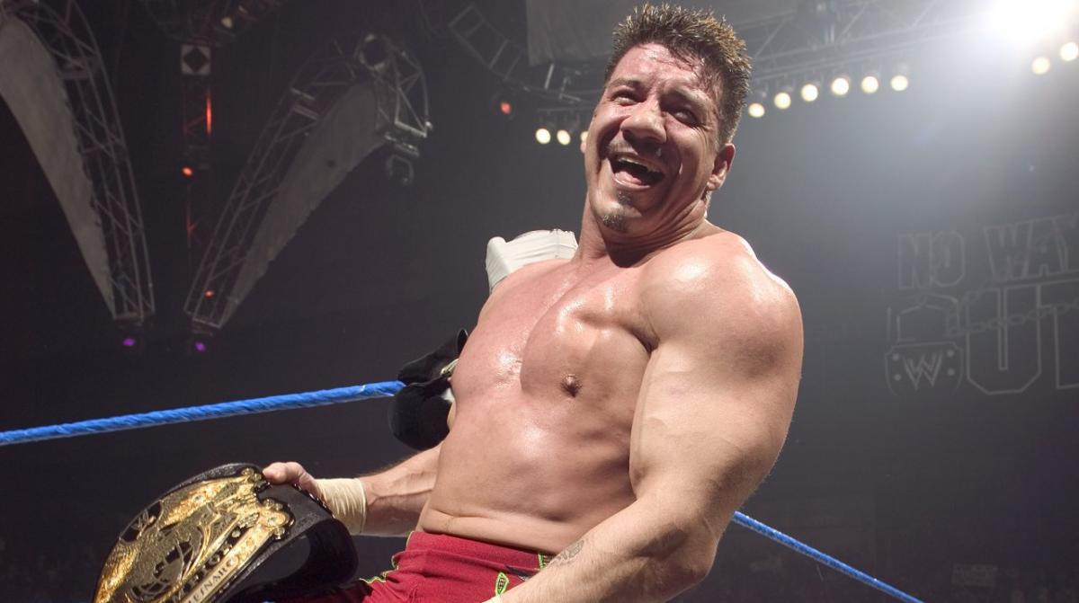 Eddie Guerrero smiles broadly as he looks into the camera.