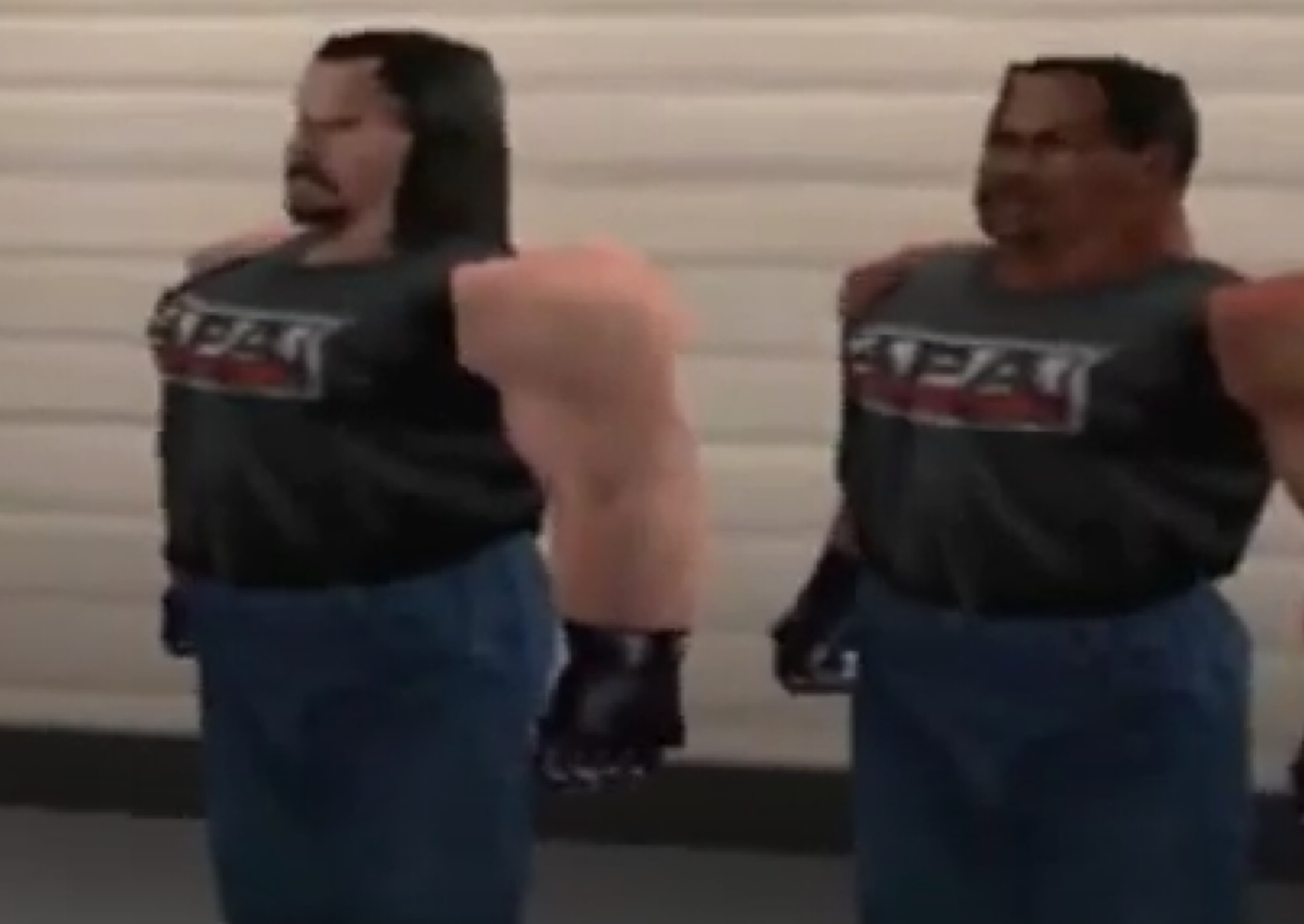 Bradshaw and Farrooq stand and stare into the distance in WWF No Mercy