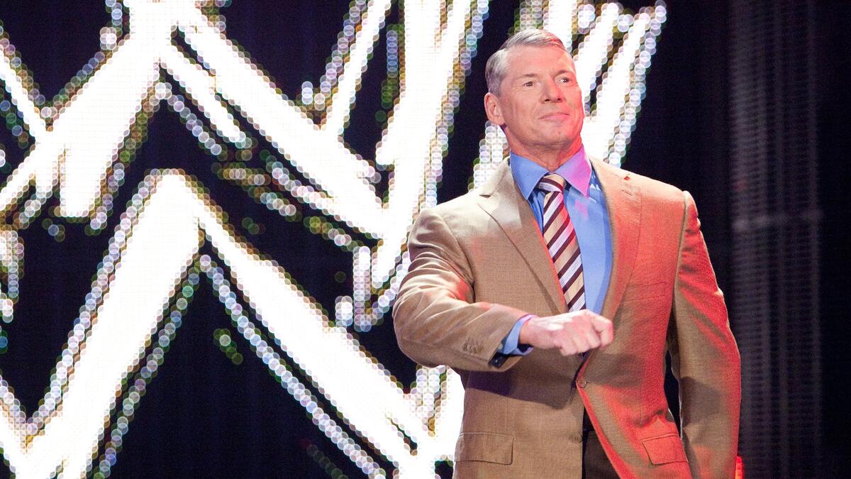 Vince McMahon walks to the ring.