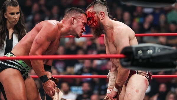 Bryan Danielson and Ricky Starks go bloody forehead to bloody forehead.