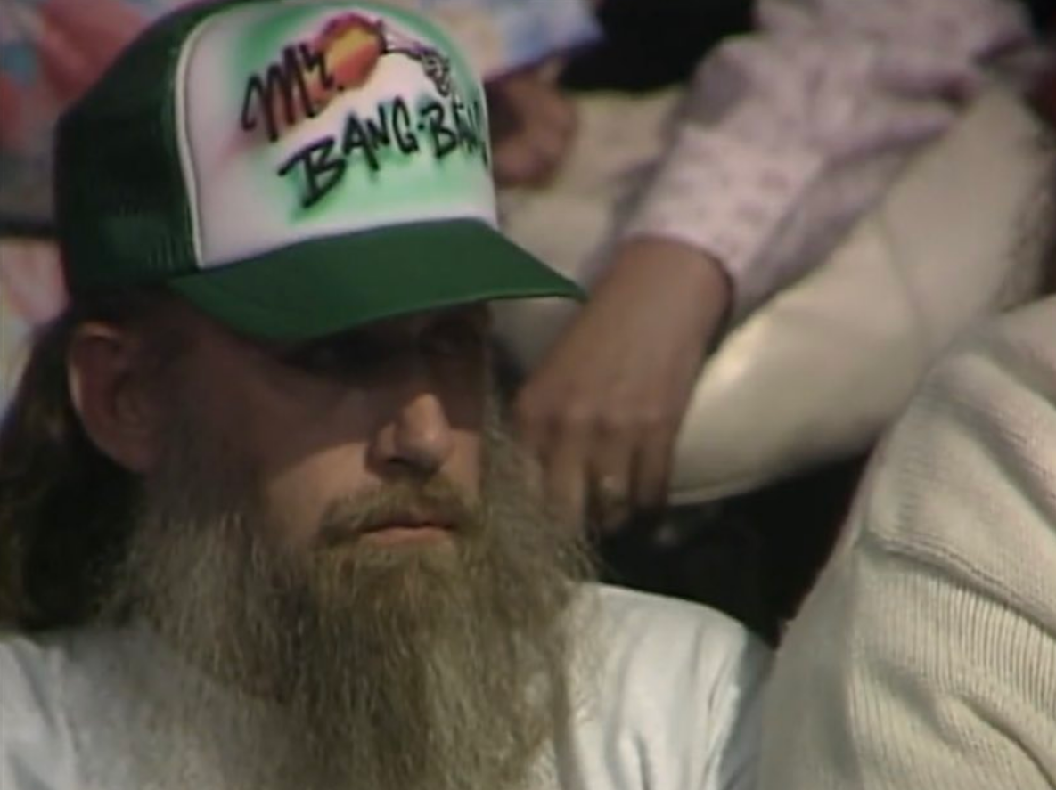 A WCW ringsider wearing a custom airbrushed "MR. BANG BANG" hat in support of Cactus Jack