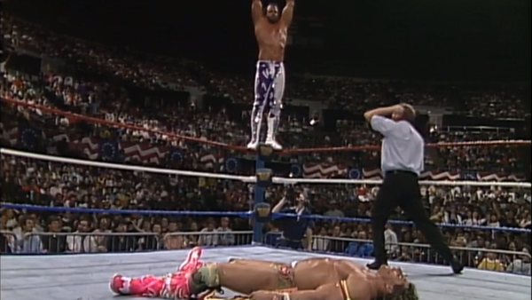 Randy Savage prepares to drop the elbow on The Ultimate Warrior